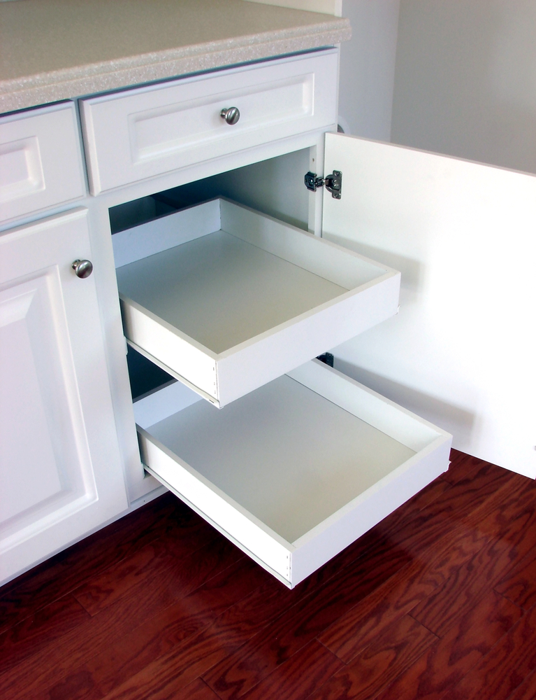 If you don't already have these built into your cabinets, you can buy add-on rolling shelves at your local home store. Here are some tips and tricks to hide your small appliances.
