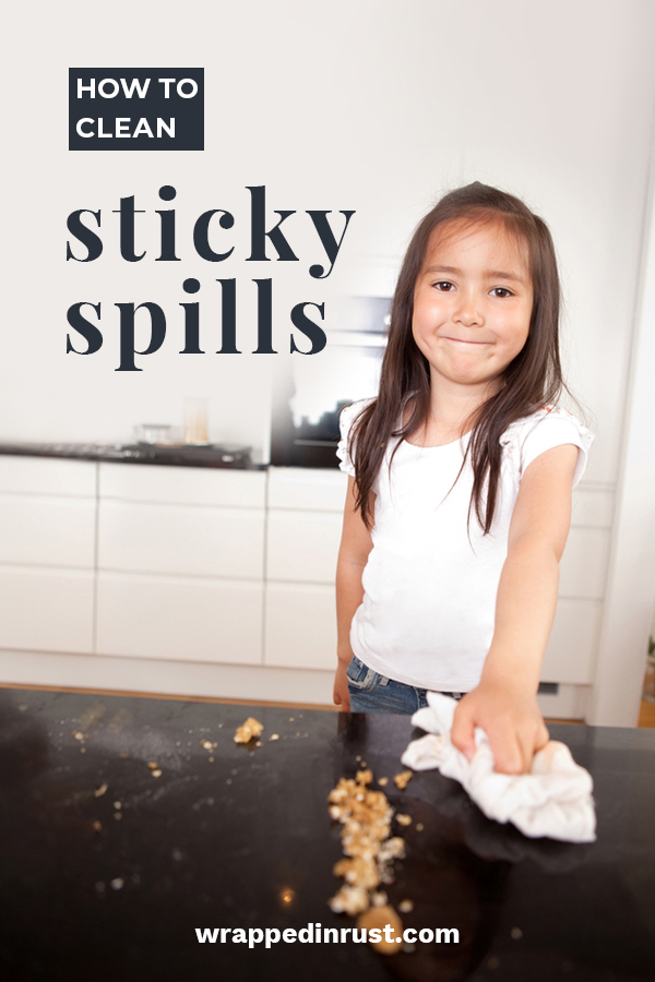 Sticky spills.... every house has them. They can be a pain but if you know the secrets to cleaning them, you won't sweat when your kids spills honey or syrup etc. Keep reading to learn my favorite way to clean sticky spills. It's really easy to deal with this mess. #howtocleanstickyspills